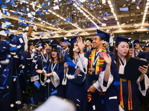 Graduates celebrate with confetti