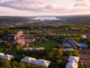A photo of the Ithaca College campus from above looking out toward Cayuga Lake.