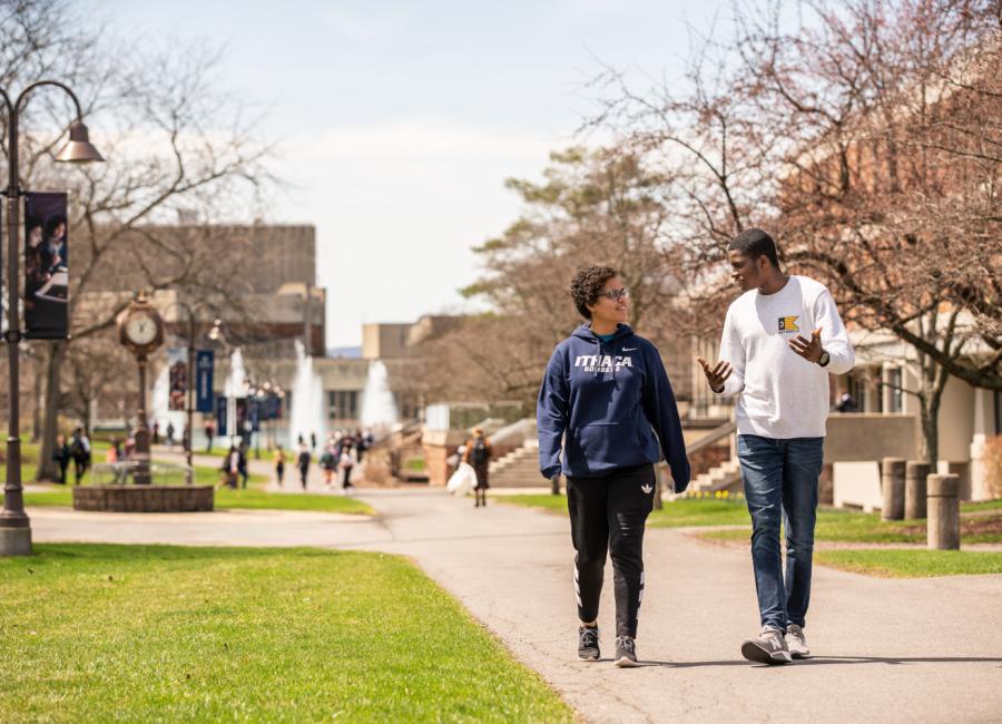 Students walking on campus in spring