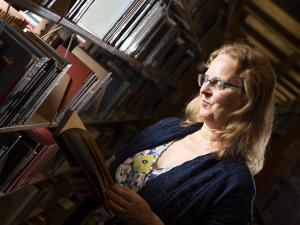 Katharine Kittredge does research in a library