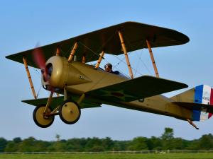 A WWI-era bi-plane taking off