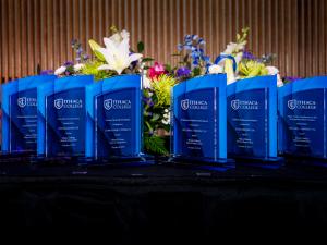 Blue glass awards on a table