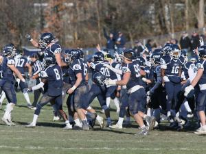 Ithaca players celebrate during the 2017 Cortaca Jug