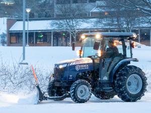 A tractor removes snow