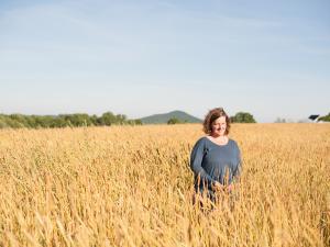 Amber Lambke in a field of grain