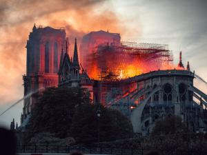 Flames rising above Notre Dame Cathedral