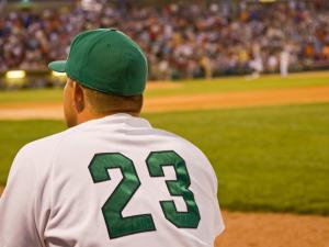 minor league baseball player looking away from the camera across a baseball field