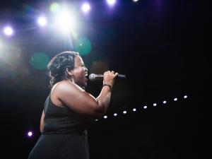 A woman singing into a microphone