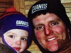 little boy and his father wearing Giants hats