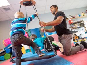 Occupational therapist student works with children