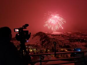 person filming fireworks
