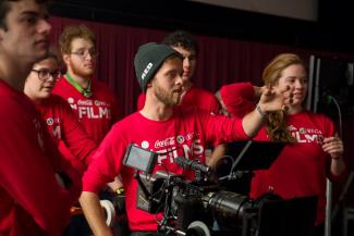 Students in red shirts use a Red camera