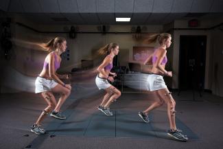 girl jumping with Vicon sensors