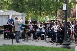 Musicians performing in a park.