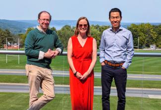 Three faculty members standing together.