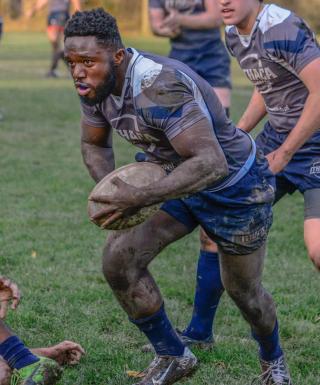 Ithaca rugby runs the ball in Upstate Championship game