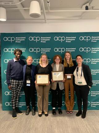 From left, Ithacan editorial board members Malik Clement, Syd Pierre, Eleanor Kay, Caitlin Holtzman, Lorien Tyne and adviser Casey Musarra pose for a photo with the Pacemaker 100 awards.