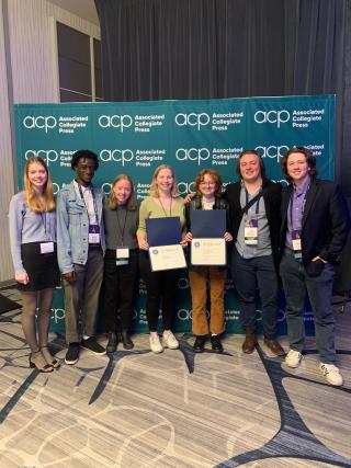 From left, Ithacan editorial board members Lorien Tyne, Malik Clement, Syd Pierre, Eleanor Kay, Caitlin Holtzman, Nolan Saunders and Aidan Charde pose for a photo with their Best of Show awards.