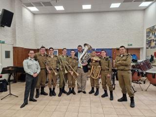members of the Israel Army Band stand with their instruments