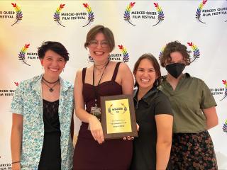 The producers of ICTV's "The Universal Truth" accepting the Merced Queer Film Festival's award for "Best Student Series."