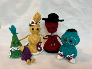 Five crocheted figures that make up the functional family