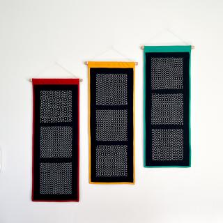 Three hitomezashi embroidery panels