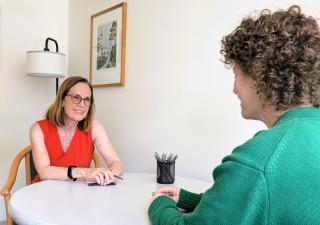 Faculty Ombuds talking to a visitor