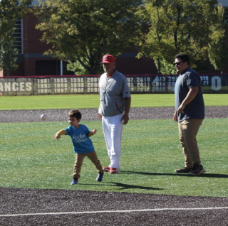 Kid throwing out the first pitch